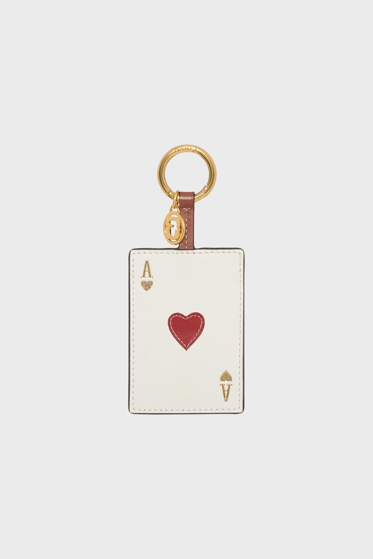 A keychain featuring a rectangular tag designed like the as de cœur playing card, with red and gold accents and a gold keyring attached, reminiscent of a médaille GD.