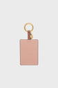 A rectangular blush pink porte-clé cuir keychain cardholder with gold hardware, featuring the text GRANT PAUL embossed in gold on the front.