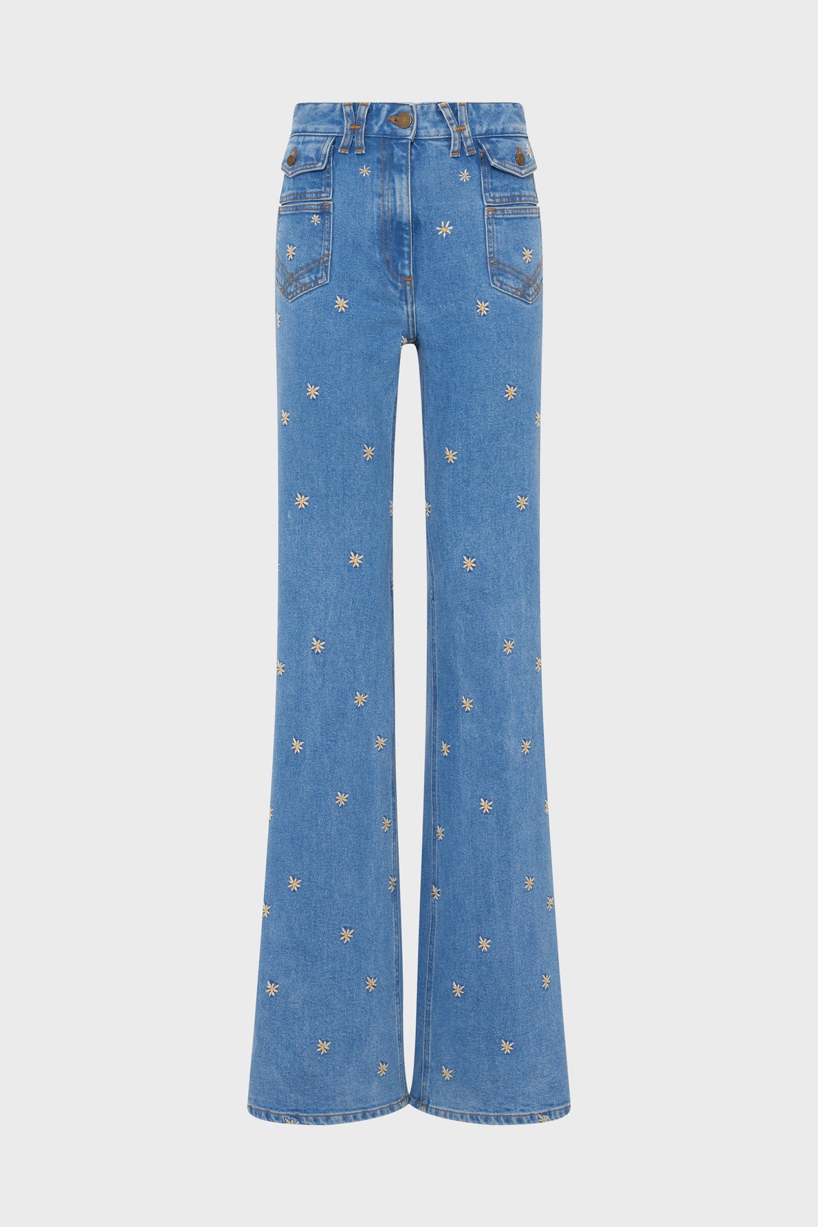 Blue high-waisted flared jeans with front pockets and an all-over small embroidered flower pattern, displayed on a white background.