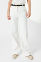 Person wearing white wide-leg pants, a black belt with gold buckle, and white sneakers. The background is plain white, and only the persons body from shoulders down is visible.