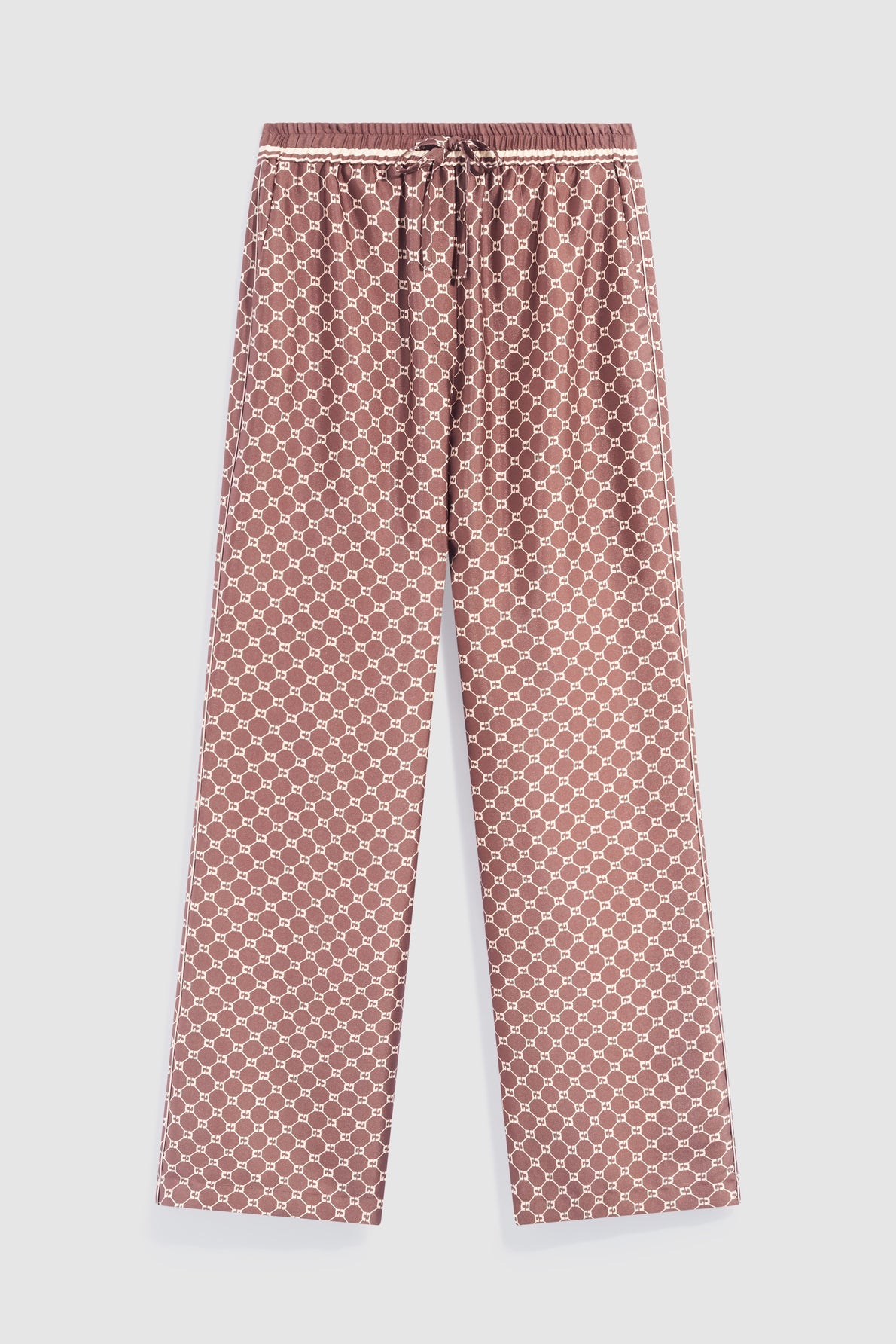 Brown satin pajama pants with a white geometric honeycomb pattern, featuring a drawstring waist and relaxed wide-leg fit, laid flat on a white background—these pantalon marron satin pants offer both comfort and style, perfect for your limited edition loungewear collection.
