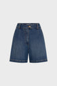 High-waisted blue denim shorts with front pleats, side pockets, belt loops, and a button-and-zip closure, displayed against a plain white background.