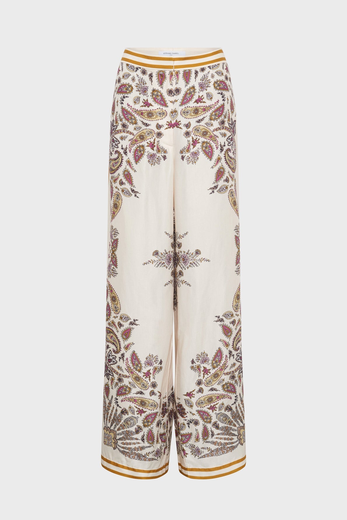 Cream-colored wide-leg pants with a paisley and floral print in burgundy, brown, and gold tones. Pants have a gold trim at the waistband and cuffs.
