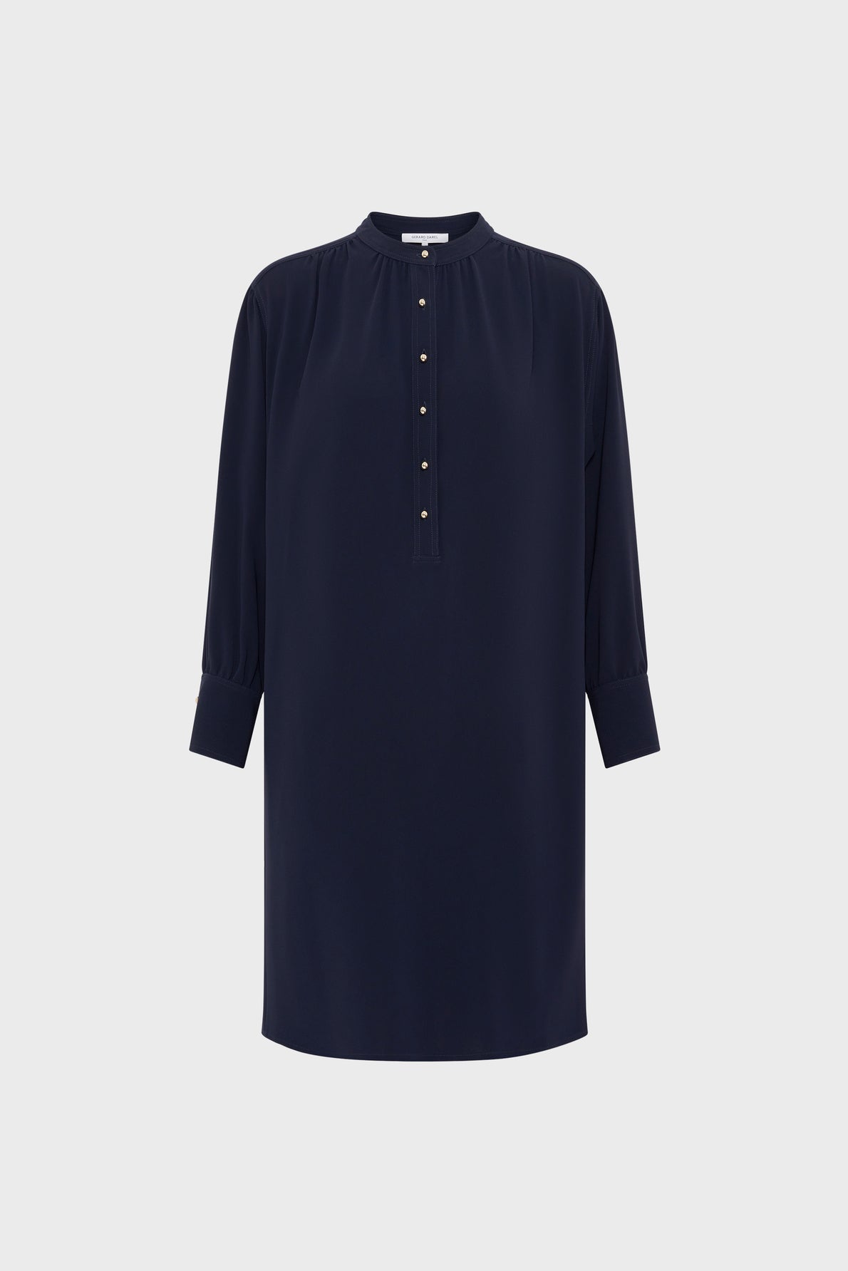 Navy blue, long-sleeve tunic dress with a col rond, button-up front placket, and cuffs. This robe courte in microfibre bleu marine features a loose fit and is displayed against a plain white background.