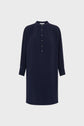 Navy blue, long-sleeve tunic dress with a col rond, button-up front placket, and cuffs. This robe courte in microfibre bleu marine features a loose fit and is displayed against a plain white background.
