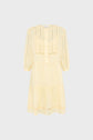 Light yellow, knee-length dress with three-quarter sleeves, front buttons, and tiered skirt. The fabric appears lightweight and features delicate lace or embroidered details on the bodice and sleeves.