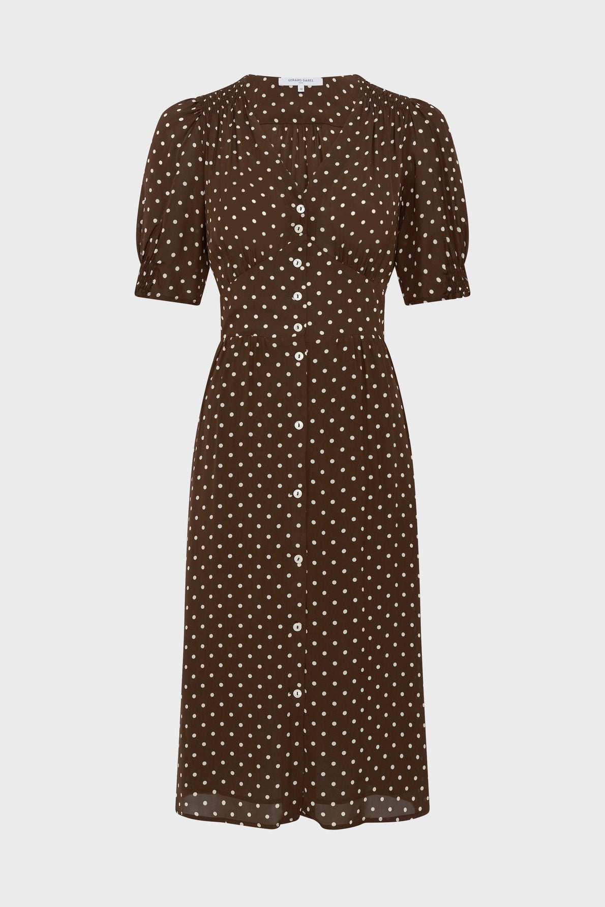 Brown short-sleeve midi dress with white polka dots, front buttons, and a fitted waist, displayed on a plain white background.