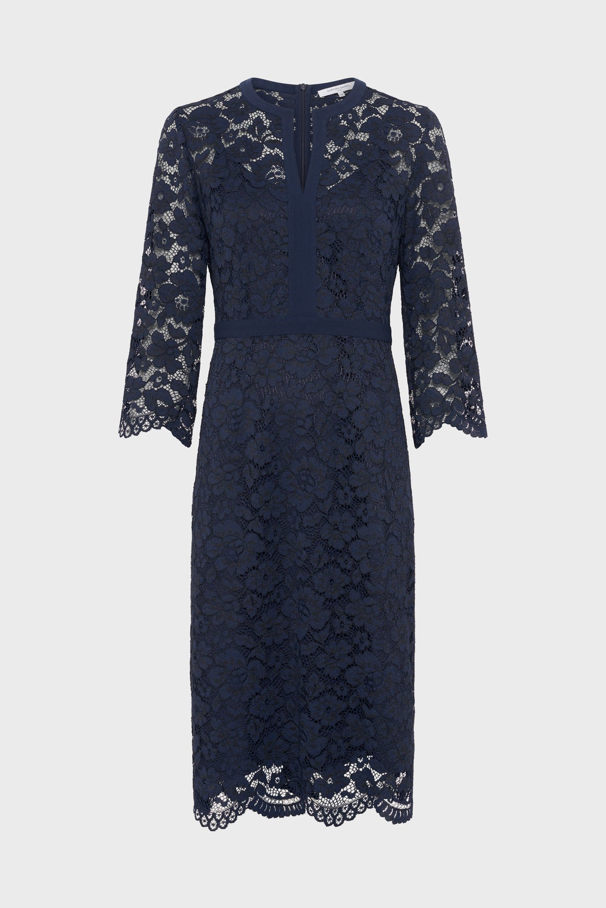 Navy blue knee-length lace dress with three-quarter sleeves, scalloped edges, and a fitted waist. This robe élégante features a floral lace overlay and a subtle V-shaped neckline with a small back zipper.