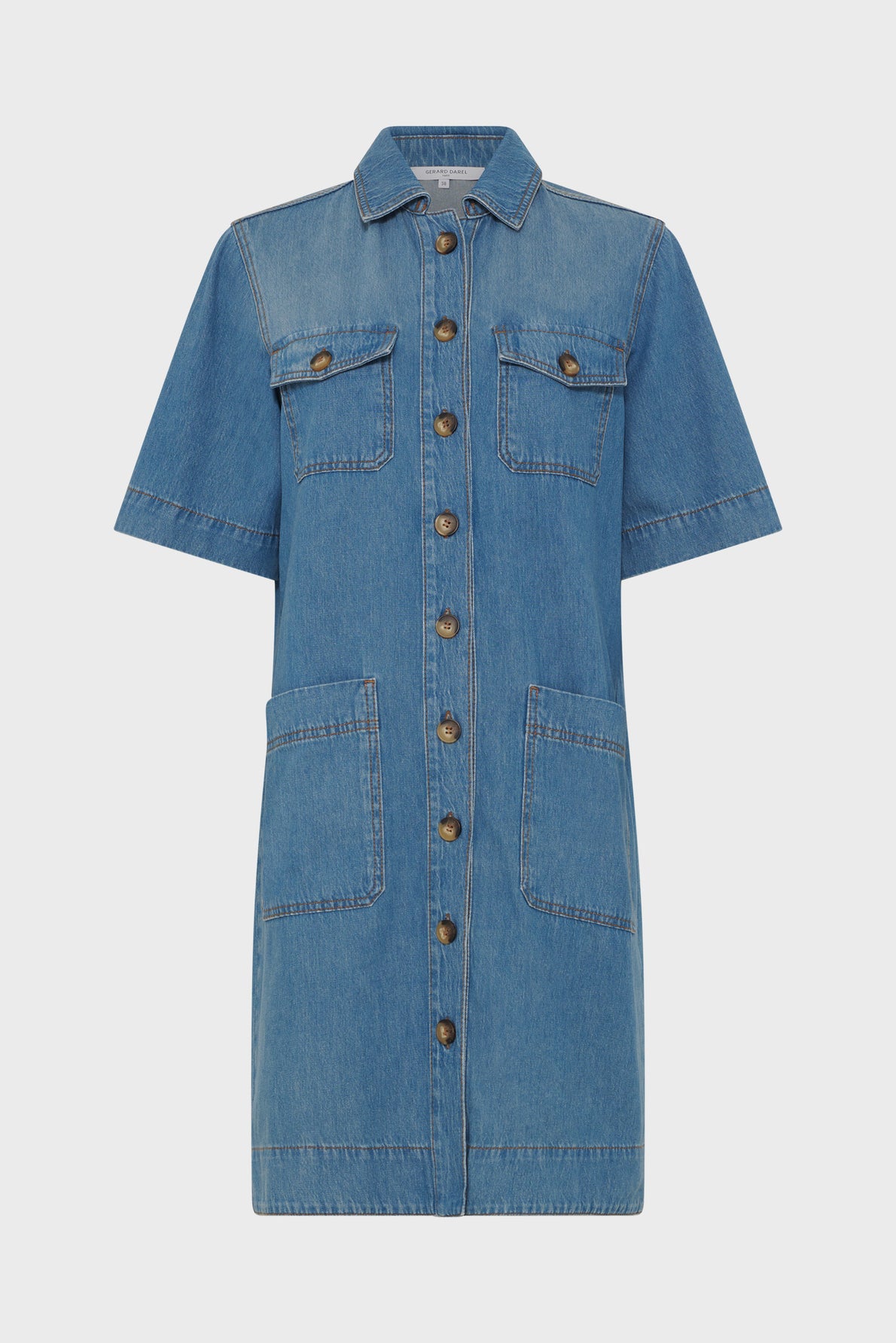 Short-sleeve denim dress with a button-down front, two chest pockets with flaps, and two large front hip pockets. The dress has visible stitching and a collar. The denim is a medium blue wash.