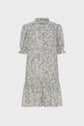 A blue robe courte with cream floral print features short puff sleeves with ruffled cuffs, a col montant à volants, and a loose, tiered skirt for an effortlessly elegant look.