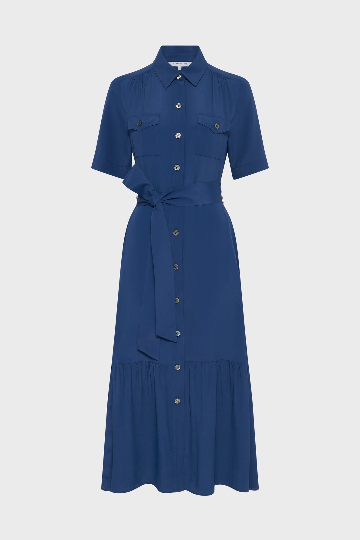 A blue, short-sleeve, button-down midi dress with a belted waist, collar, and two chest pockets, displayed on a plain white background.