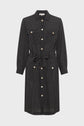 A knee-length, long-sleeve black robe chemise à pois crafted from soft viscose haboutaï, featuring white polka dots, a button-down front, two chest pockets, a collar, and a waist tie.