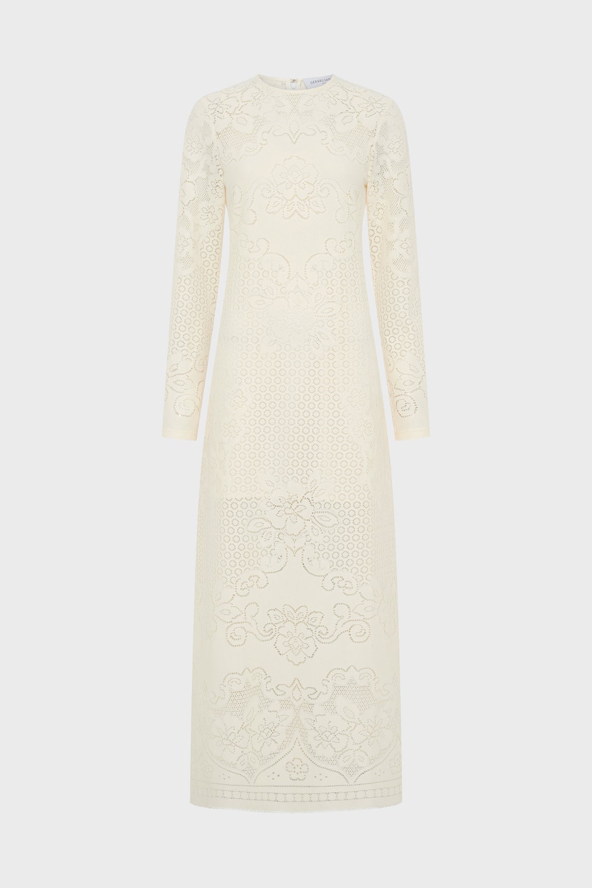 Long-sleeved, floor-length cream dress with intricate lace-like embroidered floral and geometric patterns, displayed against a plain white background.