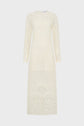 Long-sleeved, floor-length cream dress with intricate lace-like embroidered floral and geometric patterns, displayed against a plain white background.