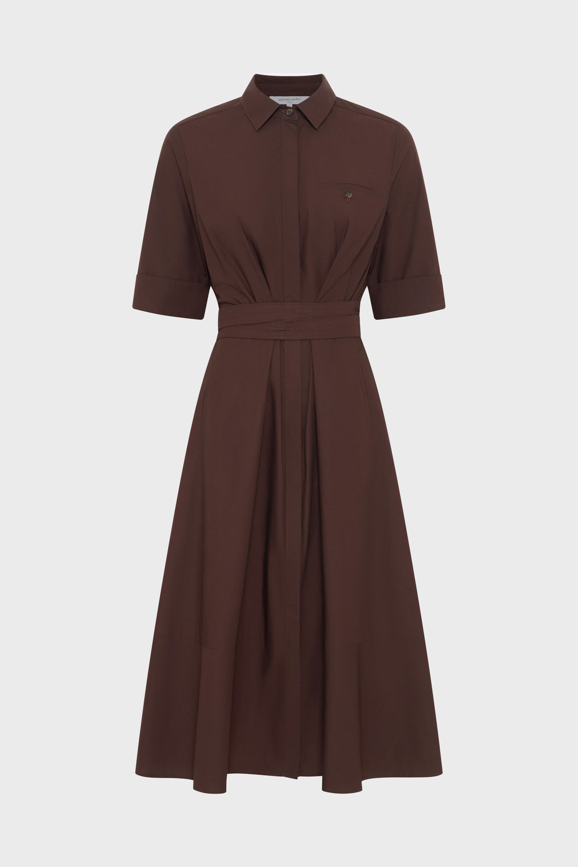 Brown, collared, short-sleeved shirt dress with a fitted waist, matching fabric belt, chest pocket, and flared midi-length skirt, displayed on a plain white background.