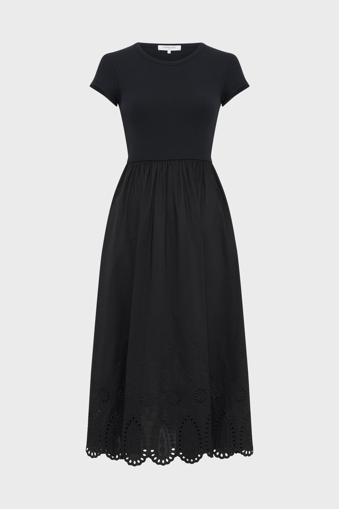 Short-sleeve black midi dress with a fitted top and a flared skirt featuring eyelet cutout details along the scalloped hem. The dress has a simple, elegant design and is displayed on a plain white background.
