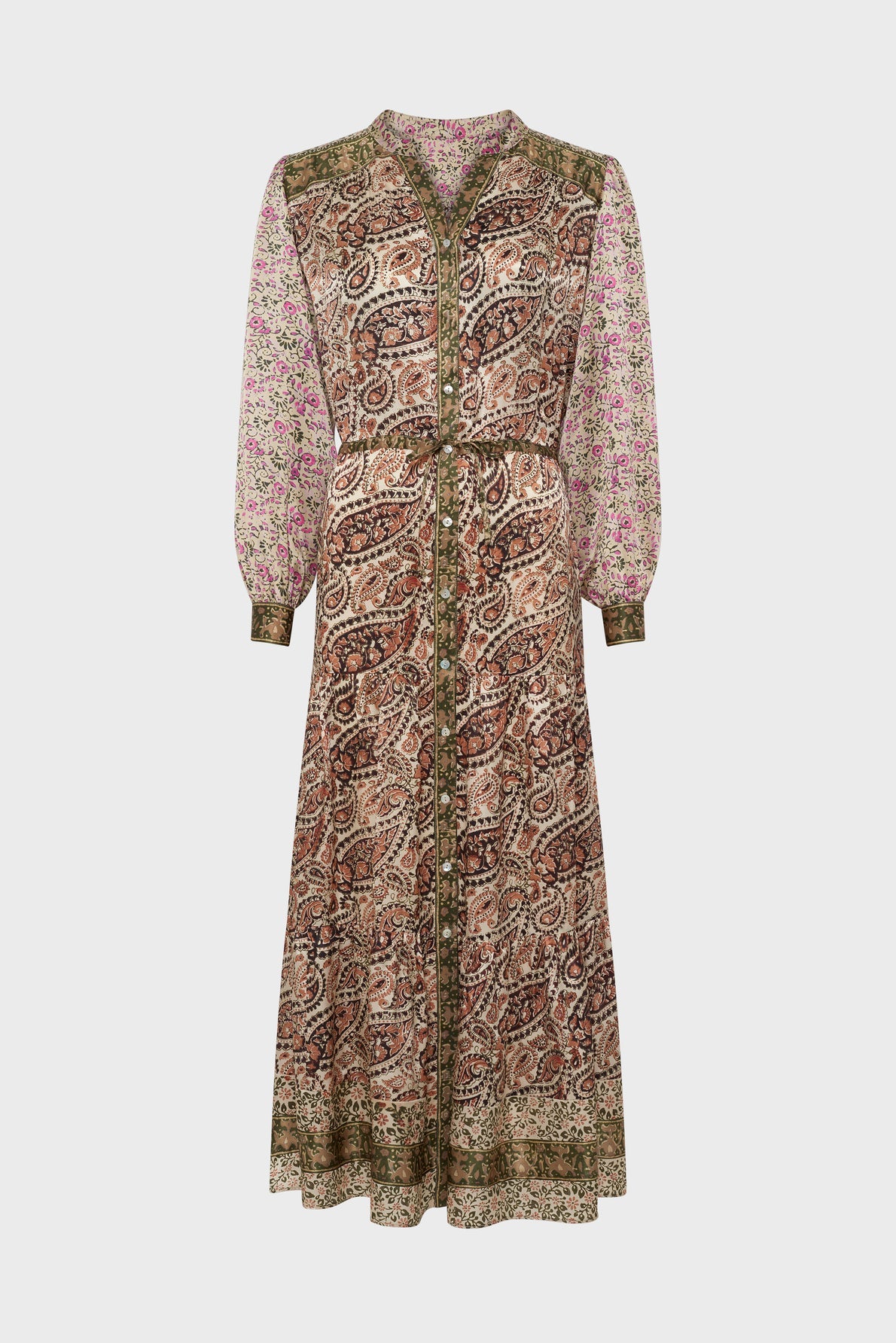 Long-sleeved, button-down midi dress with a mix of paisley and floral patterns in earthy tones of brown, green, and pink. The dress has a tie waist and a relaxed, flowing silhouette.