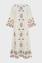 Cream-colored knee-length dress with brown broderies florales, this piece features scalloped edges on the sleeves and hem. Designed with wide, three-quarter sleeves and a relaxed, flowy fit, it effortlessly channels a look bohème against a plain white background.