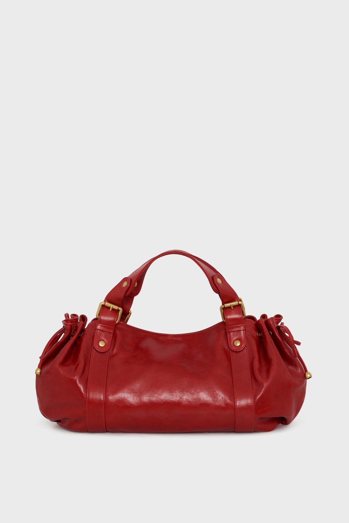 A red cuir froissé leather sac à main with gold hardware, two handles, and ruched detailing on the sides, displayed against a plain light gray background.