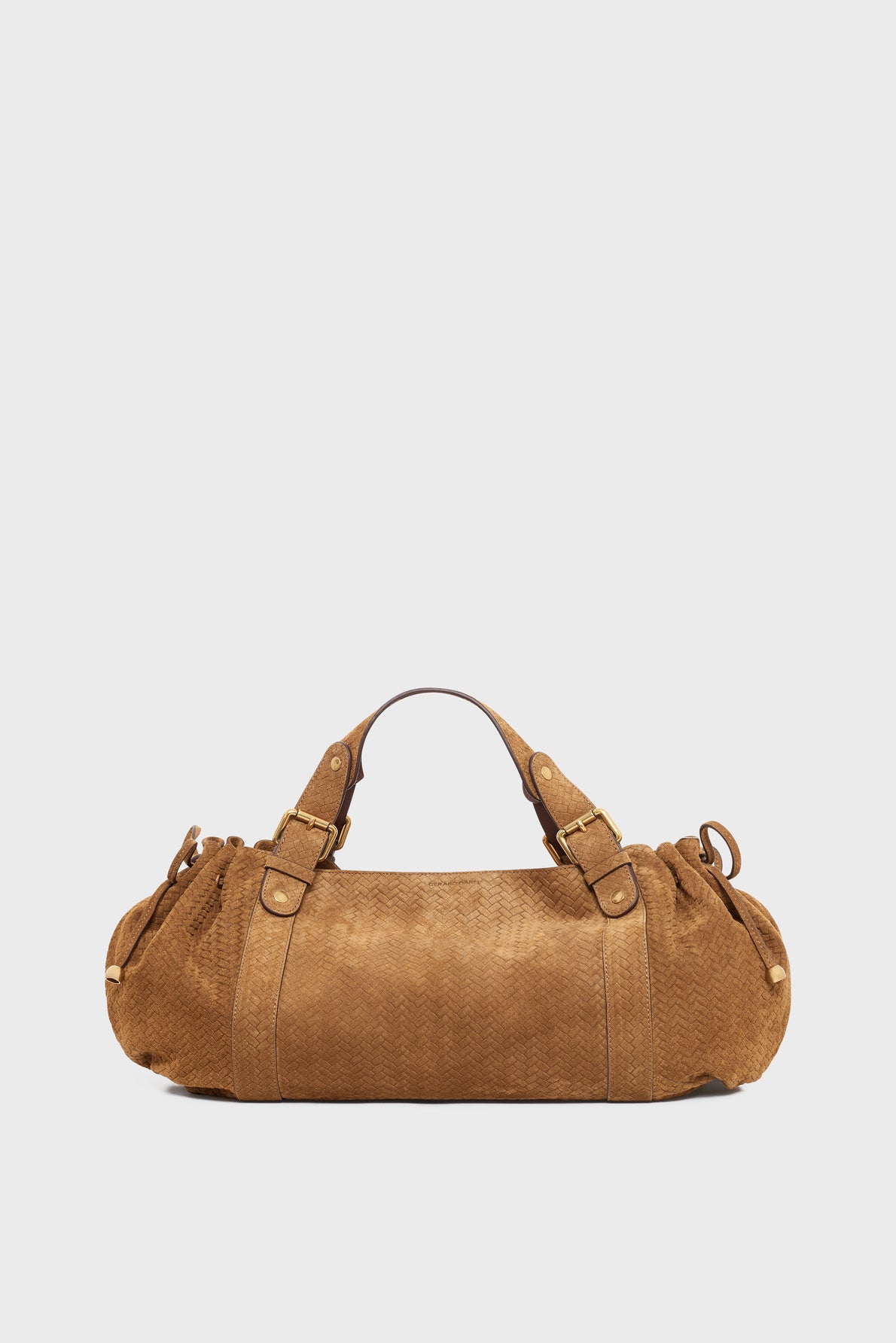 A brown, cylindrical sac à main with short handles and side buckles, made of textured cuir velours tressé, displayed on a plain white background.