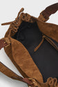 Brown woven handbag with a black fabric interior, leather straps in cuir velours tressé, and a small zippered pocket inside. The top of the sac à main features a drawstring closure.