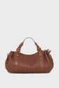 Brown cuir d’agneau tressé sac à main featuring two short handles, gold-tone hardware, and cinched sides—a refined display of savoir-faire de la Maison against a plain white background.