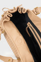 Open view of a beige sac à main tressé in luxurious cuir d’agneau with a drawstring top, black interior lining, and a zippered pocket inside—perfect for carrying your essentials 24H.
