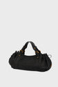 A black sac à main tressé in woven cuir d’agneau with short handles, gold hardware, and black leather accents, skillfully crafted to showcase savoir-faire artisanal, displayed against a plain light gray background.