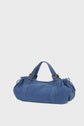 A blue denim sac à main with double handles, gold hardware, and gathered side details, set against a plain light gray background. This stylish design is reminiscent of a sac 24H, perfect for adding a touch of modern chic to your everyday look.