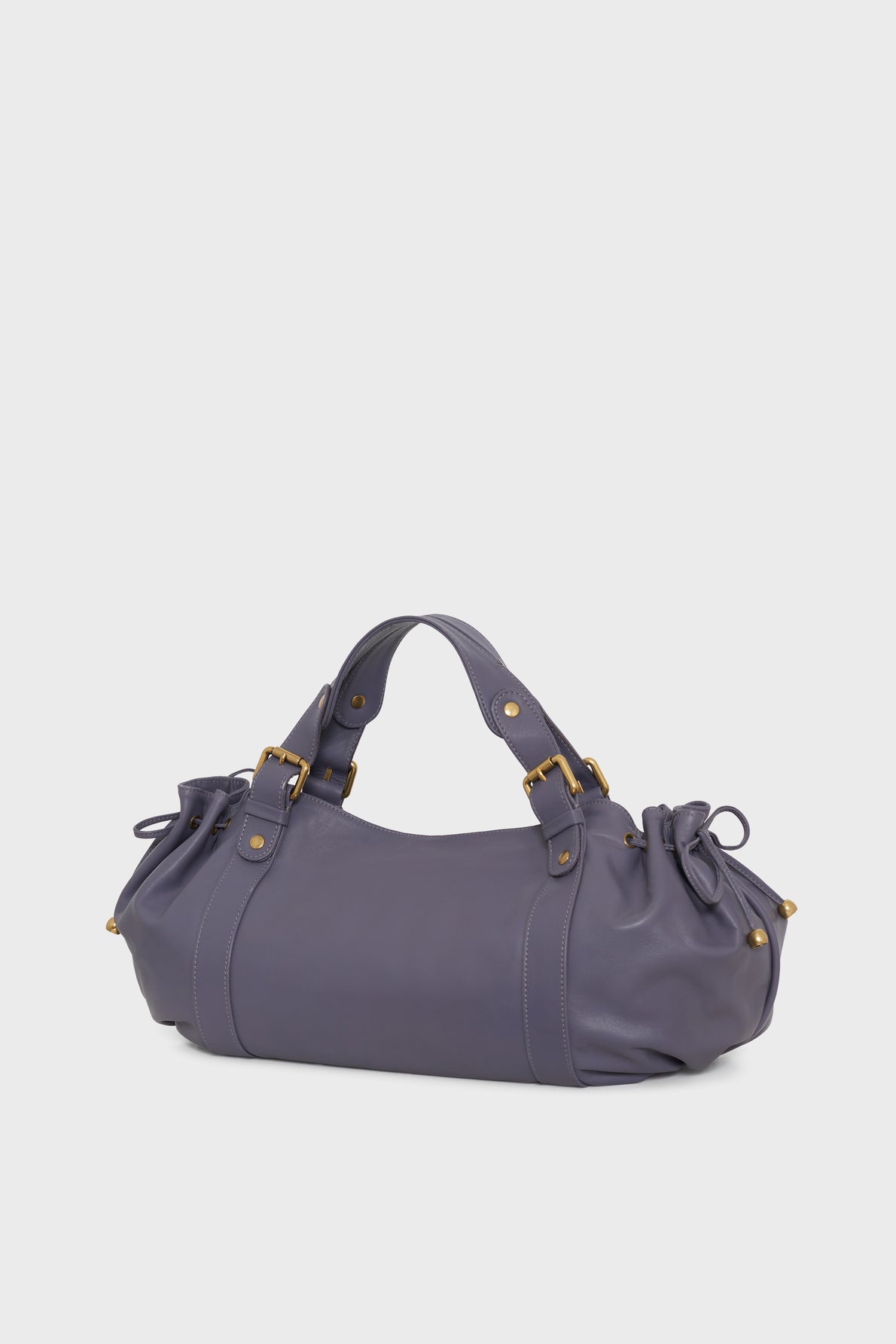 A Vanessa Bruno sac à main cuir in rich purple leather with elegant gold hardware, featuring two short handles and gathered side details, displayed on a plain white background.