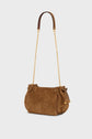 Brown woven suede sac bandoulière, also known as a mini 24H, with a gold chain strap and leather shoulder pad. Featuring side bows and a structured, rectangular shape in soft cuir velours. The background is light gray and plain.