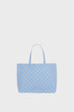 A large light blue cabas en toile with two handles and a repeating beige geometric pattern, displayed on a plain white background.