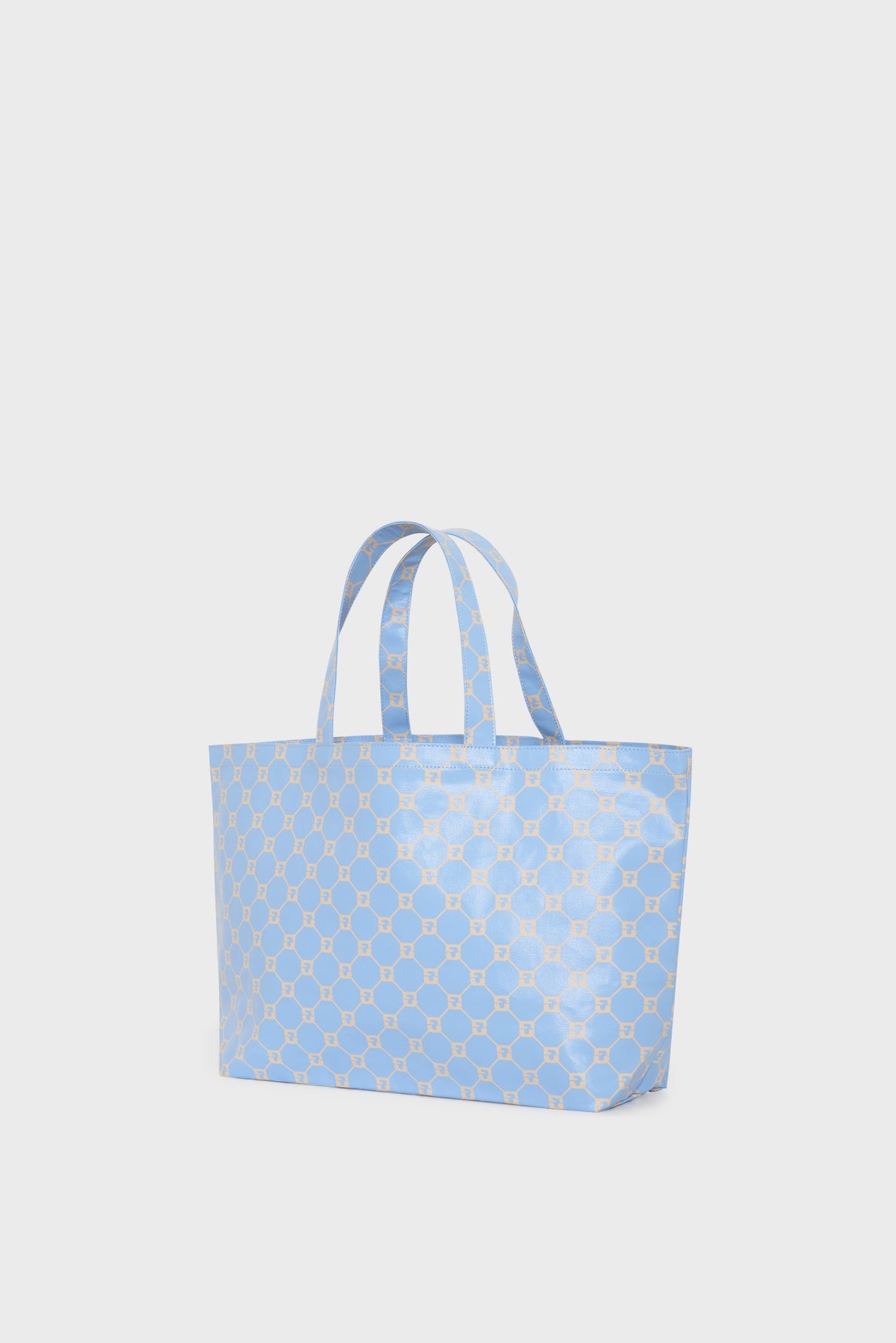 A light blue cabas en toile with two handles and a geometric beige hexagon pattern, displayed against a plain white background. This sac monogrammé is perfect for adding a subtle touch of sophistication to your everyday look.