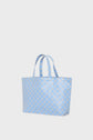 A light blue cabas en toile with two handles and a geometric beige hexagon pattern, displayed against a plain white background. This sac monogrammé is perfect for adding a subtle touch of sophistication to your everyday look.