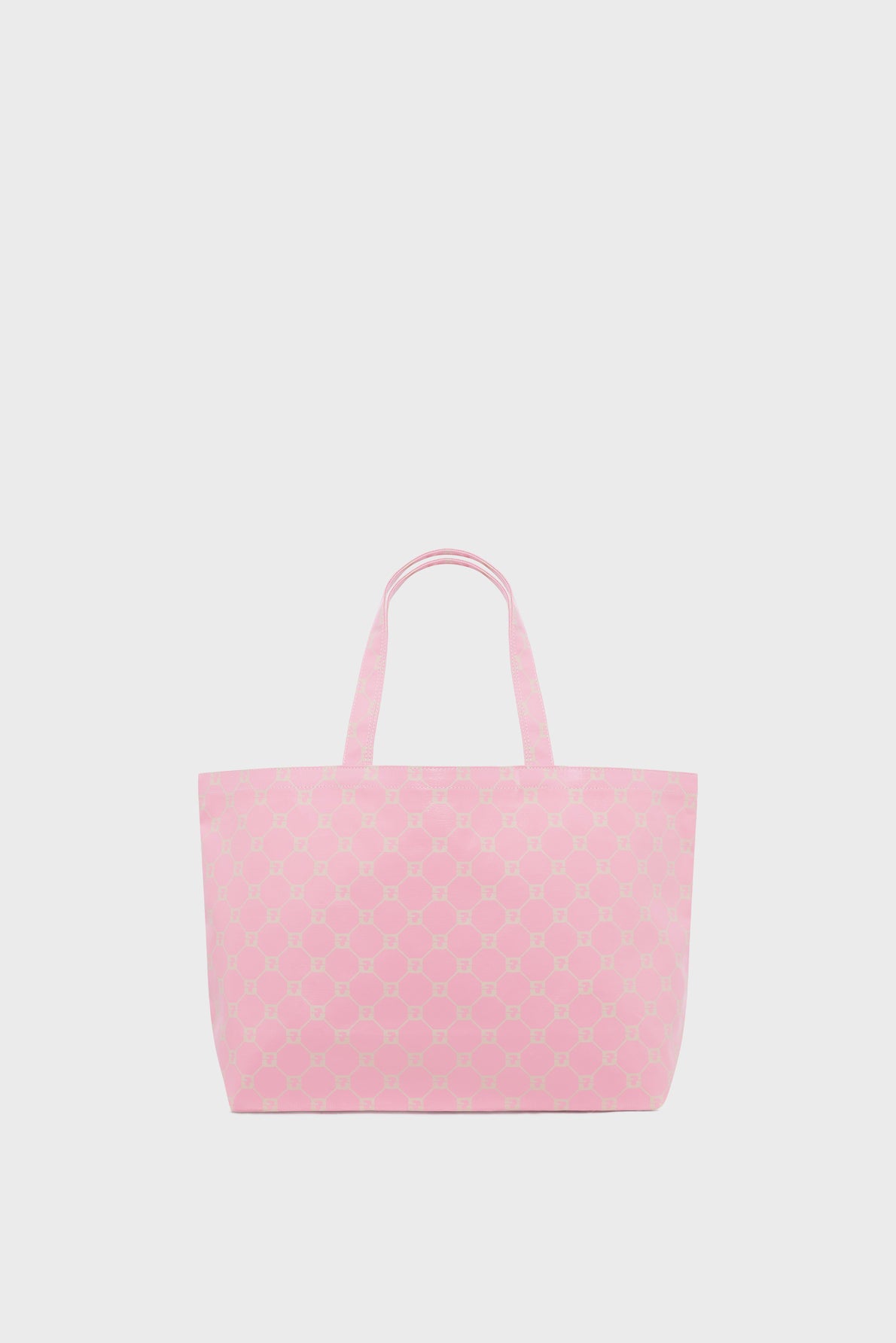 A large light pink tote bag with a geometric pattern, this chic cabas en toile features two handles and is elegantly displayed against a plain white background.