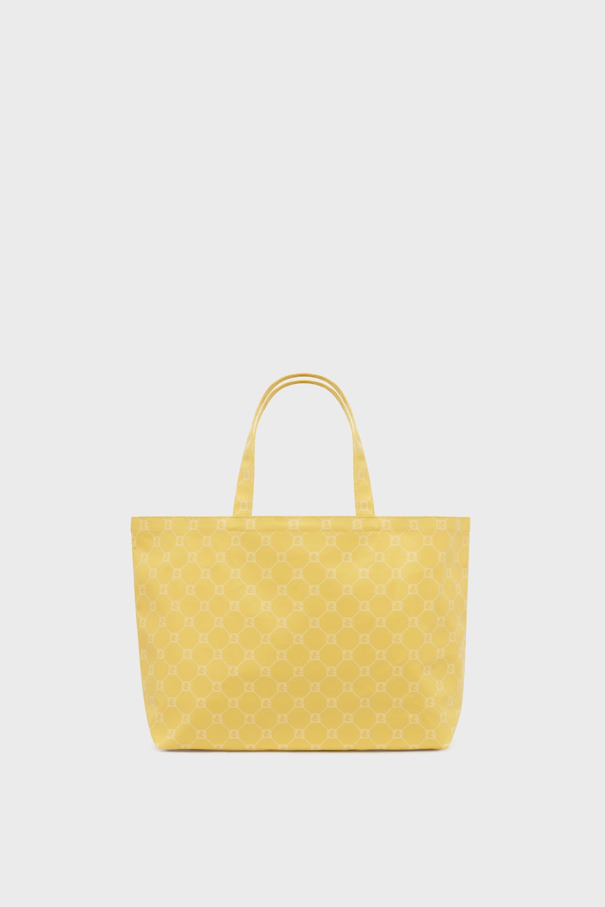 A yellow cabas en toile tote bag with two handles, featuring a subtle repeating geometric pattern, displayed against a plain white background.