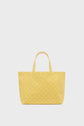 A yellow cabas en toile tote bag with two handles, featuring a subtle repeating geometric pattern, displayed against a plain white background.