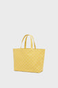 A yellow sac Le LOLITA tote bag with two handles, decorated with a subtle, repeating geometric pattern, is shown against a plain white background.