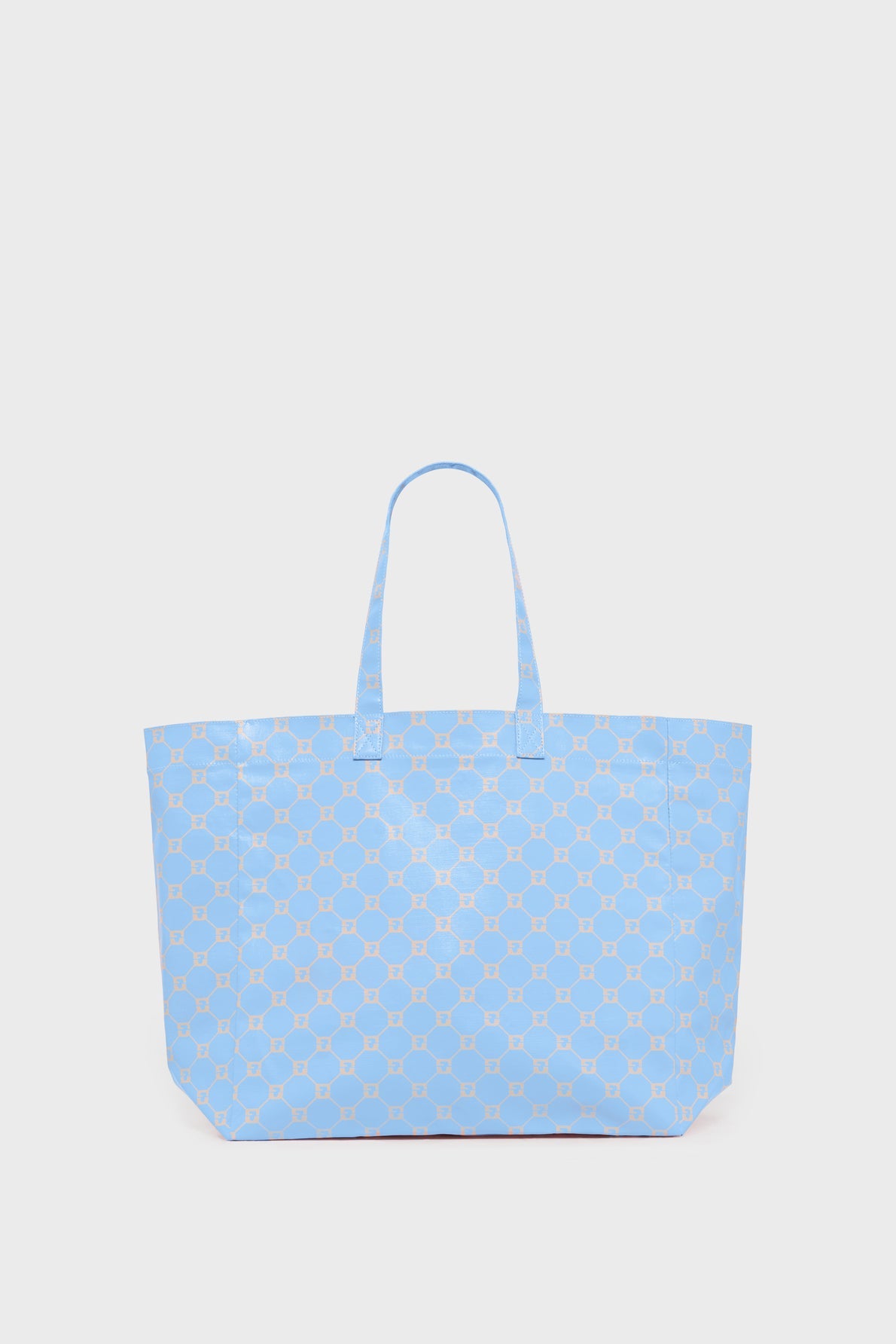A large blue cabas en toile with two handles and a repeating geometric pattern in light beige, displayed against a plain white background.