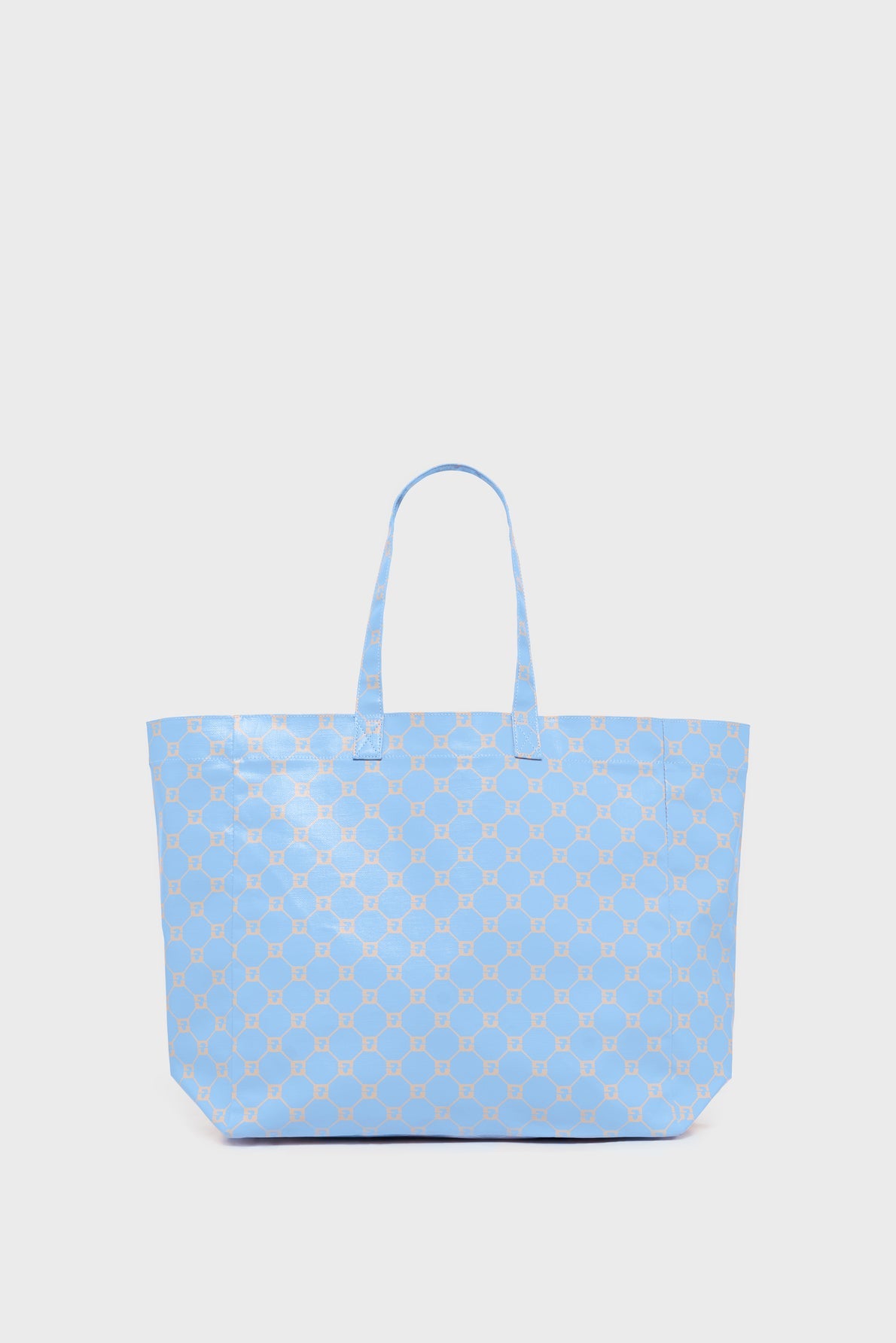 Large light blue cabas en toile tote bag with two handles, featuring a repeating beige geometric pattern on its surface, displayed against a plain white background.