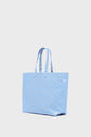 A light blue cabas en toile tote bag with two handles and a repeating geometric pattern in white, shown against a plain white background.