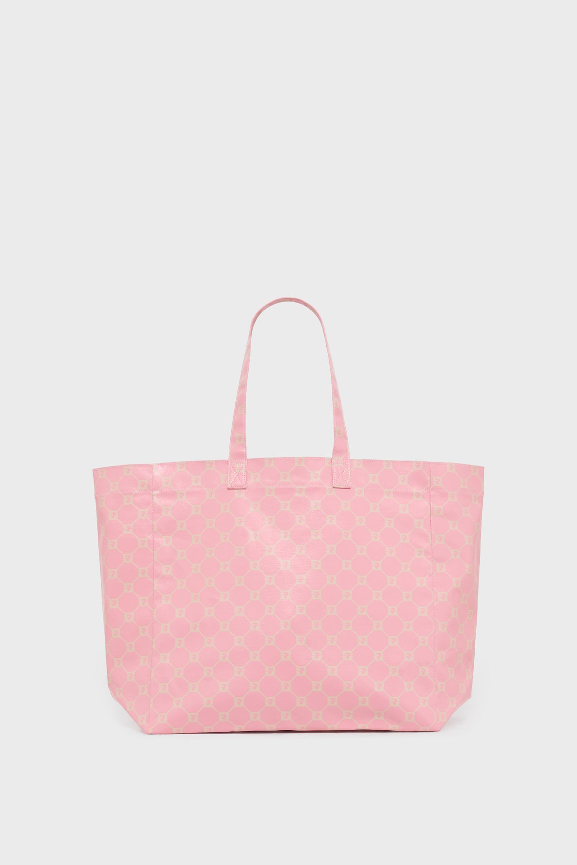 A large pink cabas en toile tote bag with thin handles and a subtle repeating geometric pattern, displayed against a plain white background.