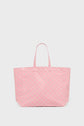 A large pink cabas en toile tote bag with thin handles and a subtle repeating geometric pattern, displayed against a plain white background.