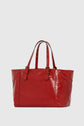 A shiny red leather tote bag with two long handles featuring gold buckles and stud details, set against a plain white background.