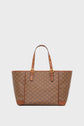 Brown checkered cabas with two adjustable poignées en cuir and gold hardware, set against a plain light background. This sac en toile enduite features a repeating square pattern with small logos inside each square.