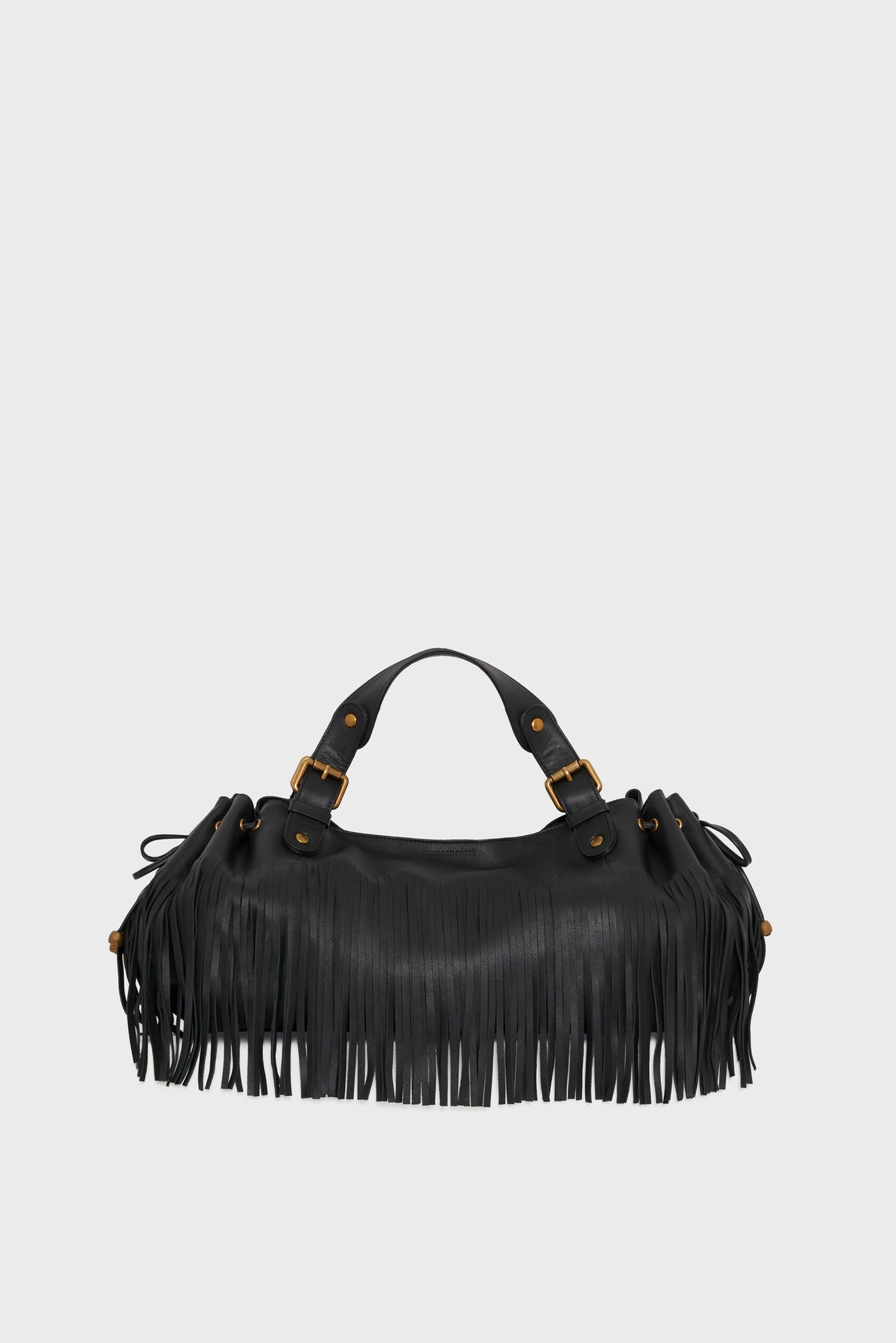 A black cuir de vachette noir leather sac à main frangé with fringe details hanging from the sides and base, two short handles, and gold buckle accents, displayed against a plain light background.