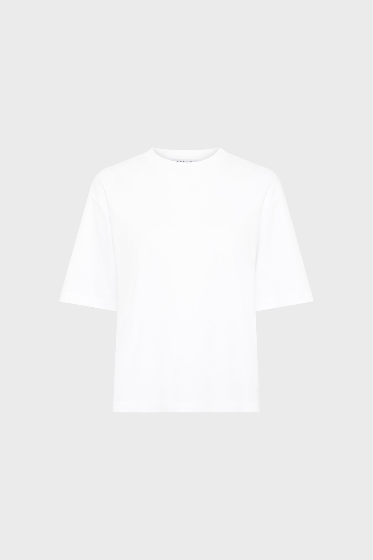 A plain white short-sleeve T-shirt blanc en coton, featuring a subtle monogramme brodé, displayed against a light gray background.