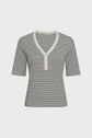 A short-sleeved, ribbed knit top with black and white horizontal stripes, a V-neckline, and a white trim along the neckline and partial front button placket.