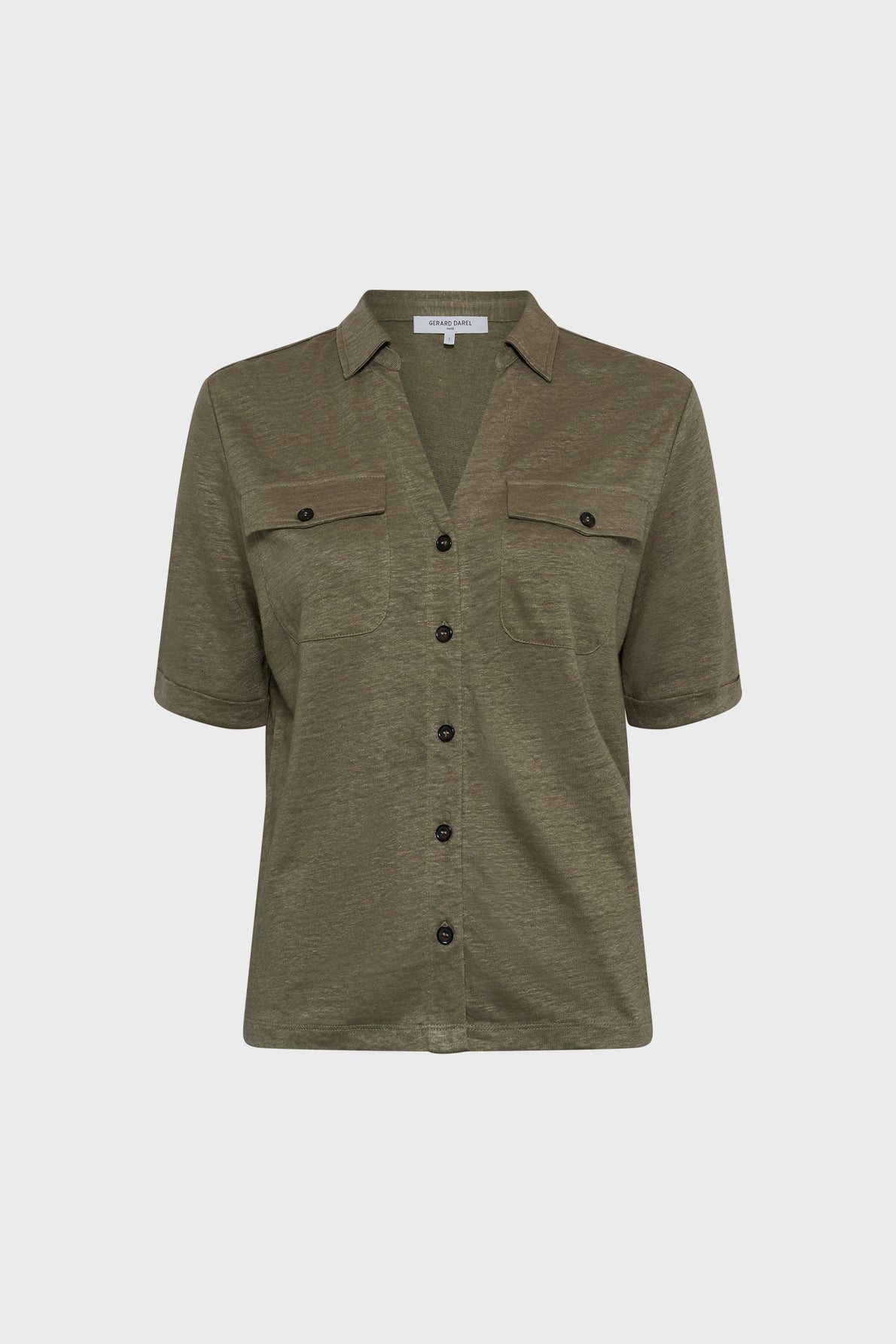 Olive green short-sleeved button-up shirt with two chest pockets and a collar, displayed on a plain white background.