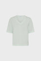 Light green short-sleeve V-neck T-shirt displayed on a plain white background, showing the front view with simple, minimal design.